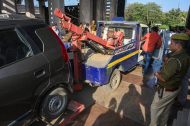 NOIDA INDIA DECEMBER 3 2024 Noida police seize vehicles of protesting farmers who were camping at Dalit Prerna Sthal over their long standing demand of additional compensation for acquired land on December 3 2024 in Noida India  clipart