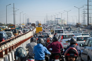 NEW DELHI, INDIA, DECEMBER 4, 2024 Massive traffic jam seen as UP Police installs barricades to stop traffic after the call of Congress leader and LOP Rahul Gandhi to visit Sambhal at NH 24 near Ghazipur on December 4 2024 in New Delhi India  clipart