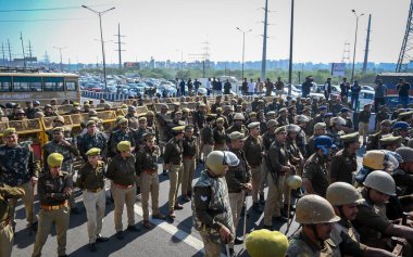 NEW DELHI INDIA DECEMBER 4 2024 UP Police officials seen blocking the road after the call of Congress leader and LOP Rahul Gandhi to visit Sambhal at NH 24 near Ghazipur on December 4 2024 in New Delhi India A Congress delegation led by Rahul Gandhi  clipart