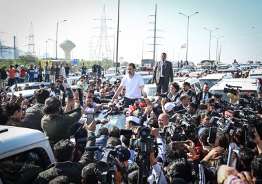 NEW DELHI INDIA DECEMBER 4 2024 Congress leader and LOP Rahul Gandhi seen along Congress Leader Priyanka Gandhi after getting stopped by UP Police while on their way towards Sambhal at NH 24 near Ghazipur Border on December 4 2024 in New Delhi India  clipart