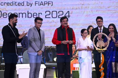 KOLKATA INDIA DECEMBER 4 2024 Chief Minister Mamata Banerjee along with MP and actor Shatrughan Sinha former Indian Captain and Brand Ambassador of West Bengal Sourav Ganguly and actor Dev during lighting the lamp ceremony of the 30th Kolkata  clipart