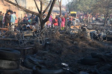 NEW DELHI, INDIA - DECEMBER 6, 2024: A fire broke out in Rani Garden, Geeta Colony, damaging 7-8 huts and nearby warehouses, on December 6, 2024 in New Delhi, India. No injuries or casualties were reported so far, an official said. clipart