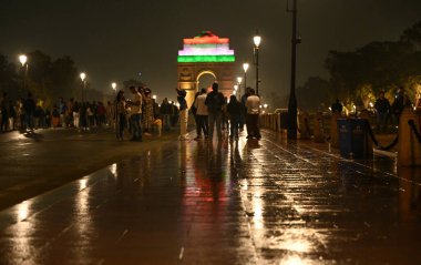 NEW DELHI, INDIA - DECEMBER 8, 2024: Delhiites get some relief from air pollution due to sudden rainfall near India Gate. Several parts of Delhi-NCR experienced heavy rainfall on Sunday, offering much-needed relief  clipart