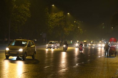 NEW DELHI, INDIA - DECEMBER 8, 2024: Delhiites get some relief from air pollution due to sudden rainfall near India Gate. Several parts of Delhi-NCR experienced heavy rainfall on Sunday, offering much-needed relief  clipart