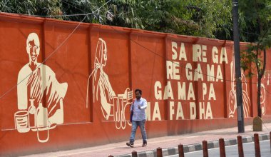 NEW DELHI INDIA APRIL 1 2023 Artists paint the wall of Delhi Universitys Indraprastha College for Women at Civil Lines on April 1 2023 in New Delhi India  clipart