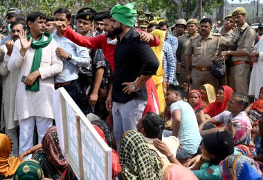 NOIDA INDIA APRIL 2 2023 Farmers of BKP Bharatiya kisan Parishad protest against the Dadri NTPC regarding land and other problems including settlements at the protest site near Harola Village at sector 5 on April 2 2023 in Noida India Photo by Sunil  clipart