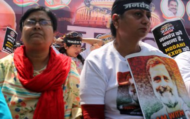 NEW DELHI, INDIA: APRIL 3, 2023 - All India Mahila Congress members on protest Save Democracy rally at Jantar Mantar to support Congress leader Rahul Gandhi after his disqualification from Parliament on April 3 2023 in New Delhi India.  clipart