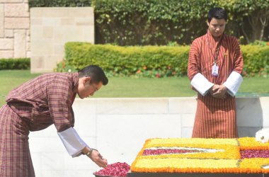 NEW DELHI INDIA APRIL 4 2023 King of Bhutan Jigme Khesar Namgyel Wangchuck pays homage to Mahatma Gandhi at Rajghat on April 4 2023 in New Delhi India Photo by Sonu Mehta Hindustan Times clipart