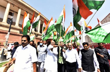 NEW DELHI, INDIA: APRIL 6, 2023 - Leader of Opposition in Rajya Sabha Mallikarjun Kharge and MPs of Opposition parties participating take out a Tricolour March from Parliament House to Vijay Chowk on April 6 2023 in New Delhi India. clipart