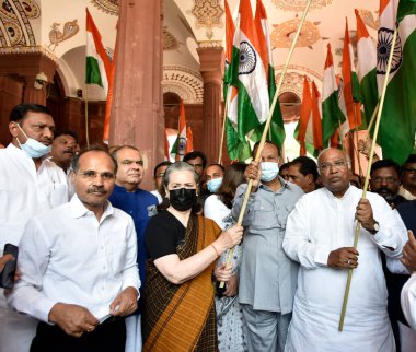 NEW DELHI, INDIA: APRIL 6, 2023 - Congress Leader and MP Sonia Gandhi along with leader of Opposition in Rajya Sabha Mallikarjun Kharge and MPs of Opposition parties participating take out a Tricolour March from Parliament House to Vijay Chowk. clipart