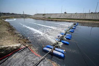 NEW DELHI INDIA APRIL 9 2023 A view of supplementary drain opening in Yamuna River as authorities have taken innovative steps to clean the drain at Wazirabad on April 9 2023 in New Delhi India The Yamuna cleaning operations are going on at full swing clipart