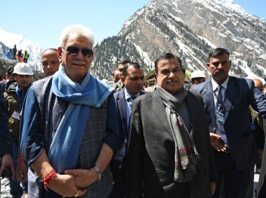 GANDERBAL INDIA APRIL 10 2023 Minister of Road Transport and Highways Nitin Gadkari with Jammu and Kashmir Lieutenant Governor Manoj Sinha inspects the construction work of Asias longest bi directional Zojila Tunnel at Baltal  clipart