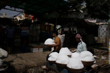 NEW DELHI INDIA APRIL 13 2023 A vendor transports buckets of Ice at Gazipur food market as heat waves started in part of Delhi NCR on April 13 2023 in New Delhi India Photo by Salman Ali Hindustan Times clipart