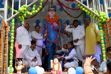 NOIDA INDIA APRIL 14 2023 People offer floral tributes on the occasion of the 133th birth anniversary of Dalit icon BR Ambedkar at Ambedkar Park sector 95 on April 14 2023 in Noida India Ambedkar Jayanti is an annual festival celebrated in India to c clipart