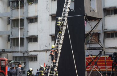 MUMBAI INDIA APRIL 15 2023 Firemen perform during a drill competition held at Mumbai Fire Brigade MFB headquarters at Byculla on April 15 2023 in Mumbai India Photo by Bhushan Koyande Hindustan Times clipart