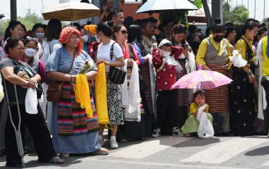 NEW DELHI INDIA APRIL 19 2023 Devotees and followers gather in large numbers at the IGI Airport to welcome the Dalai Lama Tibetan spiritual leader on his visit to take part in the Global Buddhism Summit on April 19 2023 in New Delhi India The event i clipart