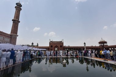 NEW DELHI INDIA APRIL 21 2023 Muslim devotees offer Alvida Namaz on the last Friday of the holy month of Ramadan at Jama Masjid on April 21 2023 in New Delhi India  clipart