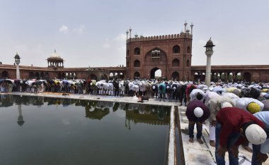 NEW DELHI INDIA APRIL 21 2023 Muslim devotees offer Alvida Namaz on the last Friday of the holy month of Ramadan at Jama Masjid on April 21 2023 in New Delhi India  clipart