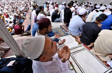 NEW DELHI INDIA APRIL 21 2023 Muslim devotees offer Alvida Namaz on the last Friday of the holy month of Ramadan at Jama Masjid on April 21 2023 in New Delhi India  clipart