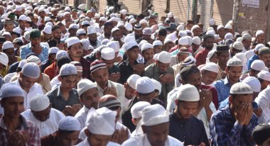 NEW DELHI, INDIA: APRIL 22, 2023 - Muslims offer prayers at Gandhi Nagar main road outside the Masjid on the occasion of Eid ul Fitr in East Delhi on April 22 2023 in New Delhi India Muslims around the world are getting into the festive Eid spirit.  clipart