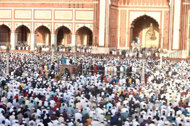 NEW DELHI, INDIA: APRIL 22, 2023 - Muslims offer prayers at the Jama Masjid on the occasion of Eid ul Fitr at Jama Masjid in Old Delhi on April 22 2023 in New Delhi India Muslims around the world are getting into the festive Eid spirit.  clipart