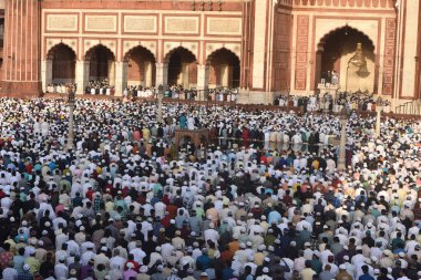 NEW DELHI, INDIA: APRIL 22, 2023 - Muslims offer prayers at the Jama Masjid on the occasion of Eid ul Fitr at Jama Masjid in Old Delhi on April 22 2023 in New Delhi India Muslims around the world are getting into the festive Eid spirit.  clipart