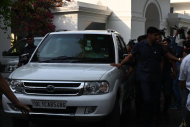 NEW DELHI INDIA APRIL 22 2023 Congress leader Rahul Gandhi leaves with Sonia Gandhi and Priyanka Gandhi in a car after handing over the keys of 12 Tughlak Lane bungalow to a CPWD official on April 22 2023 in New Delhi India Gandhi who was disqualifie clipart