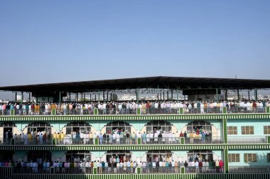 NOIDA INDIA APRIL 22 2023 Muslims offer prayers namaz on the occasion of Eid Ul Fitr at the Sector 8 Jama Masjid on April 22 2023 in Noida India Muslims around the world are getting into the festive Eid spirit as the holy month of Ramadan concludes T clipart