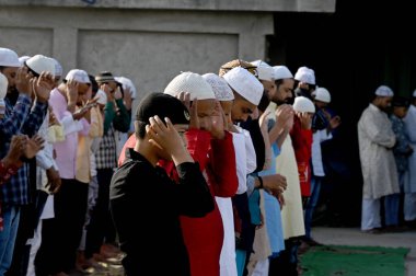 NOIDA INDIA APRIL 22 2023 Muslims offer prayers namaz on the occasion of Eid Ul Fitr at the Sector 8 Jama Masjid on April 22 2023 in Noida India Muslims around the world are getting into the festive Eid spirit as the holy month of Ramadan concludes T clipart