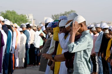 NOIDA INDIA APRIL 22 2023 Muslims offer prayers namaz on the occasion of Eid Ul Fitr at the Sector 8 Jama Masjid on April 22 2023 in Noida India Muslims around the world are getting into the festive Eid spirit as the holy month of Ramadan concludes T clipart