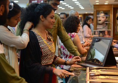 MUMBAI INDIA APRIL 22 2023 People purchasing gold ornaments on the occasion of Akshaya Tritiya Jewellery Shop at Dadar on April 22 2023 in Mumbai India Akshaya Tritiya also known as Akti or Akha Teej is a popular Hindu and Jain spring festival that o clipart