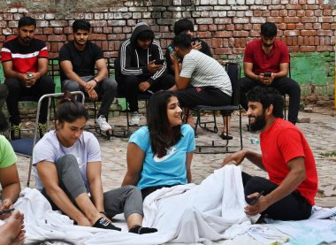 NEW DELHI INDIA APRIL 24 2023 Indian Wrestler Bajang Punia along Vinesh Phogat wakes up in the morning after they stayed over night at Jantar Mantar in protest against the President of Wrestling Federation on April 24 2023 in New Delhi India Photo by clipart