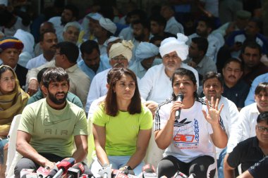 NEW DELHI INDIA APRIL 25 2023 Wrestlers Bajrang Punia Vinesh Phogat Sakshi Malik along with Khap Panchayat members during a protest against WFI President Brij Bhushan Sharan Singh over different allegations at Jantar Mantar on April 25 2023 in New De clipart