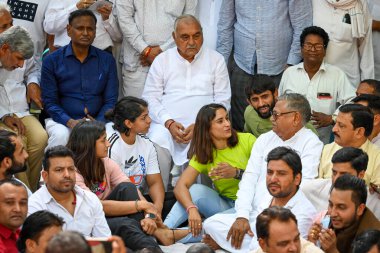 NEW DELHI INDIA APRIL 25 2023 Bhupinder Singh Hooda Former CM of Haryana arrives to meet and support the Indian wrestlers Bajrang Punia Vinesh Phogat and Sakshi Malik who sit on protest against the president of Wrestling Federation of India at Jantar clipart