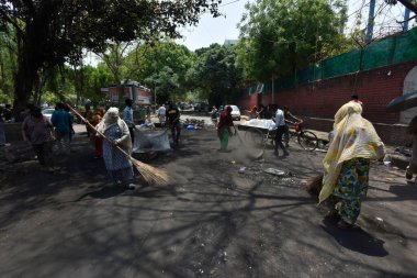 NEW DELHI INDIA APRIL 25 2023 Charred remains of a shop are seen after a massive fire broke out that gutted shops and roadside stalls at the mini market area of Sarojini Nagar on April 25 2023 in New Delhi India Five fire tenders were rushed to the s clipart