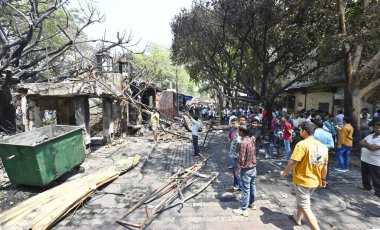 NEW DELHI INDIA APRIL 25 2023 Charred remains of a shop are seen after a massive fire broke out that gutted shops and roadside stalls at the mini market area of Sarojini Nagar on April 25 2023 in New Delhi India Five fire tenders were rushed to the s clipart