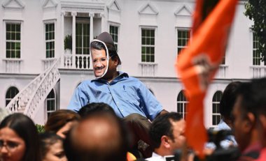 NEW DELHI INDIA: APRIL 27 2023 - Delhi BJP workers raise slogans during a protest against Delhi Chief Minister Arvind Kejriwal accusing him of spending crores on the renovation of his official residence on April 27 2023 in New Delhi India. clipart