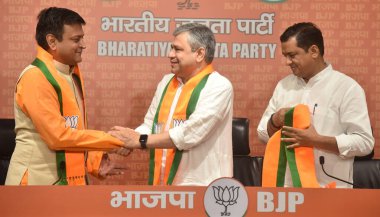 NEW DELHI, INDIA: APRIL 28, 2023 - Former JD U leader Ajay Alok joins Bharatiya Janata Party in the presence of Ashwini Vaishnaw Minister of Railway and IT and other BJP Leaders at BJP HQ DDU Marg on April 28 2023 in New Delhi India.  clipart