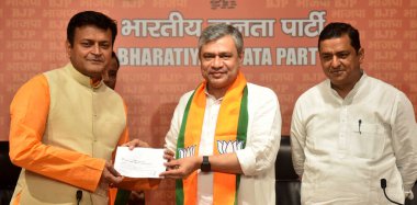 NEW DELHI, INDIA: APRIL 28, 2023 - Former JD U leader Ajay Alok joins Bharatiya Janata Party in the presence of Ashwini Vaishnaw Minister of Railway and IT and other BJP Leaders at BJP HQ DDU Marg on April 28 2023 in New Delhi India.  clipart