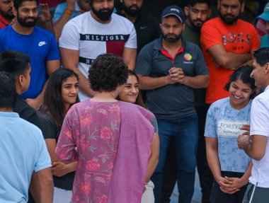 NEW DELHI INDIA: APRIL 29, 2023 - Congress leader Priyanka Gandhi with wrestlers Bajrang Punia Vinesh Phogat Sakshi Malik and Sangita Phogat during their protest at Jantar Mantar on April 29 2023 in New Delhi India Wrestlers resumed their protest. clipart