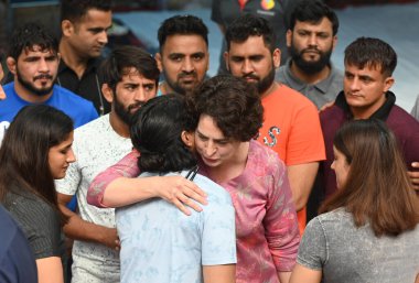 NEW DELHI INDIA: APRIL 29, 2023 - Congress leader Priyanka Gandhi Vadra and Deepender Hooda meet Wrestlers Bajrang Punia Vinesh Phogat Sakshi Malik and others during the seventh day dharna protest against the Wrestling Federation of India president. clipart