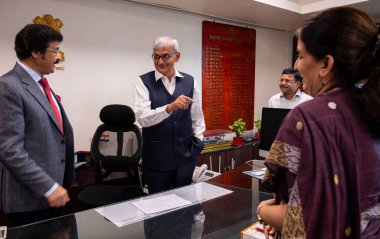 MUMBAI INDIA APRIL 30 2023 Newly elected Chief Secretary of Maharashtra Manoj Saunik took charge today from earlier Chief Secretary Manu Kumar Srivastava on this occasion his wife Sujata Saunik was also present at Chief Secretary Office Mantralaya on clipart