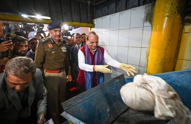 NEW DELHI INDIA DECEMBER 17 2024 Vinai Kumar Saxena Lieutenant Governor of Delhi Delhi along with Delhi Police commissioner Sanjay Arora destroys the illegal drugs during an Illegal Drug Destruction event at a Facility in Jahangirpuri on December 17  clipart