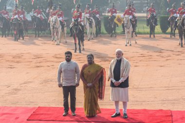 NEW DELHI INDIA DECEMBER 16 2024 President Droupadi Murmu poses with Prime Minister Narendra Modi and Sri Lankan Anura Kumara Dissanayake during Anura s ceremonial reception at the presidential palace Rashtrapati Bhavan on December 16 2024 in New Del clipart