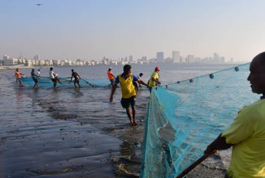 MUMBAI INDIA DECEMBER 16 2024 Fisheries Department Mangrove Foundation and local fisherman during the Ocean Plastic Clean up Campaign involved in collecting garbage plastic floating in the sea near Girgaon Chowpatty on December 16 2024 in Mumbai Indi clipart