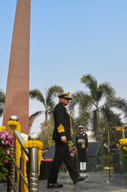 NOIDA INDIA DECEMBER 18 2024 Vice Admiral Krishna Swaminathan AVSM VSM Vice Chief of the Naval Staff pays homage to 38 martyrs at Shaheed Smarak Sector 29 during Vijay Diwas celebrations on December 18 2024 in Noida India Photo by Sunil Ghosh Hindust clipart