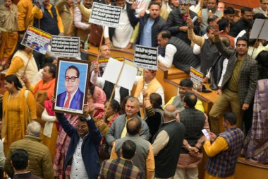 NEW DELHI INDIA DECEMBER 19 2024 AAP and BJP MCD councilors hold placards of Baba Bhimrao Ambedkar and shout slogans during the MCD special house meeting at MCD Headquarters Civic Center on December 19 2024 in New Delhi India Photo by Raj K Raj Hindu clipart