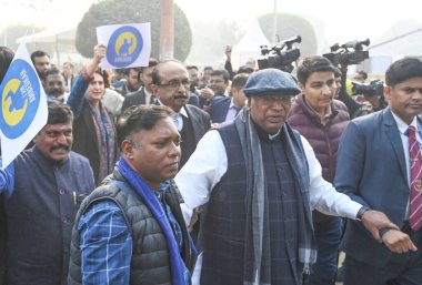 NEW DELHI INDIA DECEMBER 20 2024 Congress MP Priyanka Gandhi Vadra with Congress president Mallikarjun Kharge lead the Opposition protest march form Vijay Chowk to Parliament against the alleged insult of Babasaheb Ambedkar by the Union Home Minister clipart