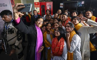 NEW DELHI INDIA DECEMBER 21 2024 Delhi Chief Minister Atishi interact with School students during the Lehar 2024 Art Exhibition organised at Shankar's Centre for Children CBT at Chanakyapuri on December 21 2024 in New Delhi India The exhibition was o clipart