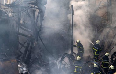 MUMBAI, INDIA - DECEMBER 28, 2024: Massive fire broke out to scrape and plastic materials iGodowns at Wajid Ali Compound, Khairani Road, Sakinaka, on December 28, 2024 in Mumbai, India. Fire Brigade officials reported no injuries. clipart